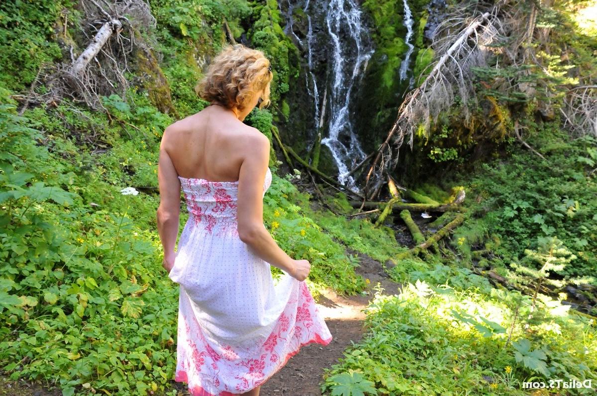 20P Pretty Delia by waterfall erect under her dress