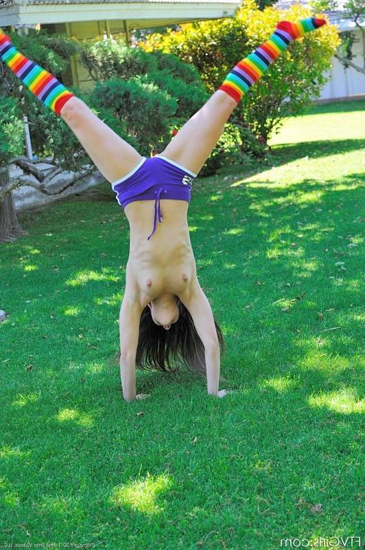 15P Flexible brunette does naked cartwheels in the park