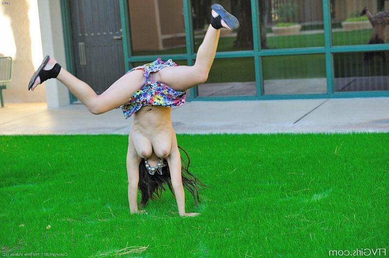 15P Busty teen beauty does a naked cartwheel in public