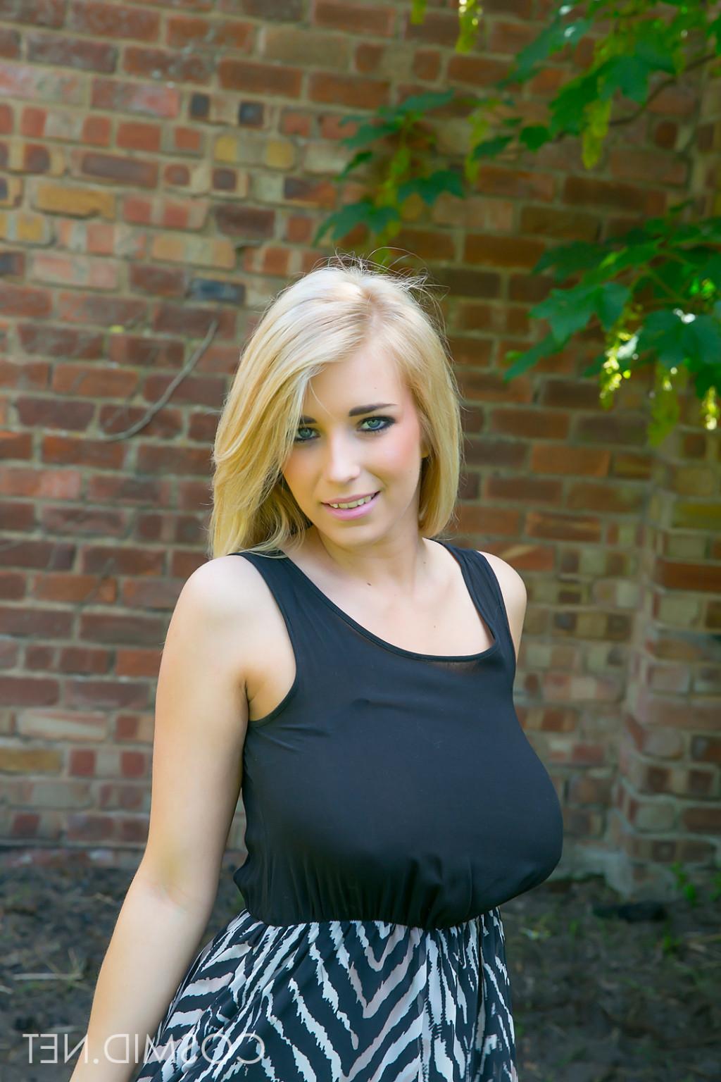 16P Cute blonde with big boobies pulls her dress off outside