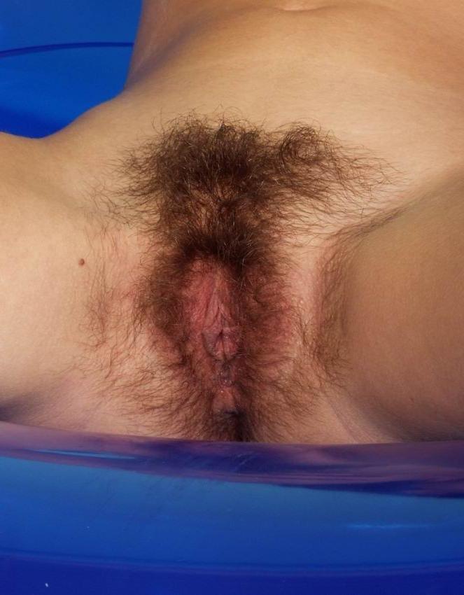 15P cutie spreads her hairy pussy and shows pink