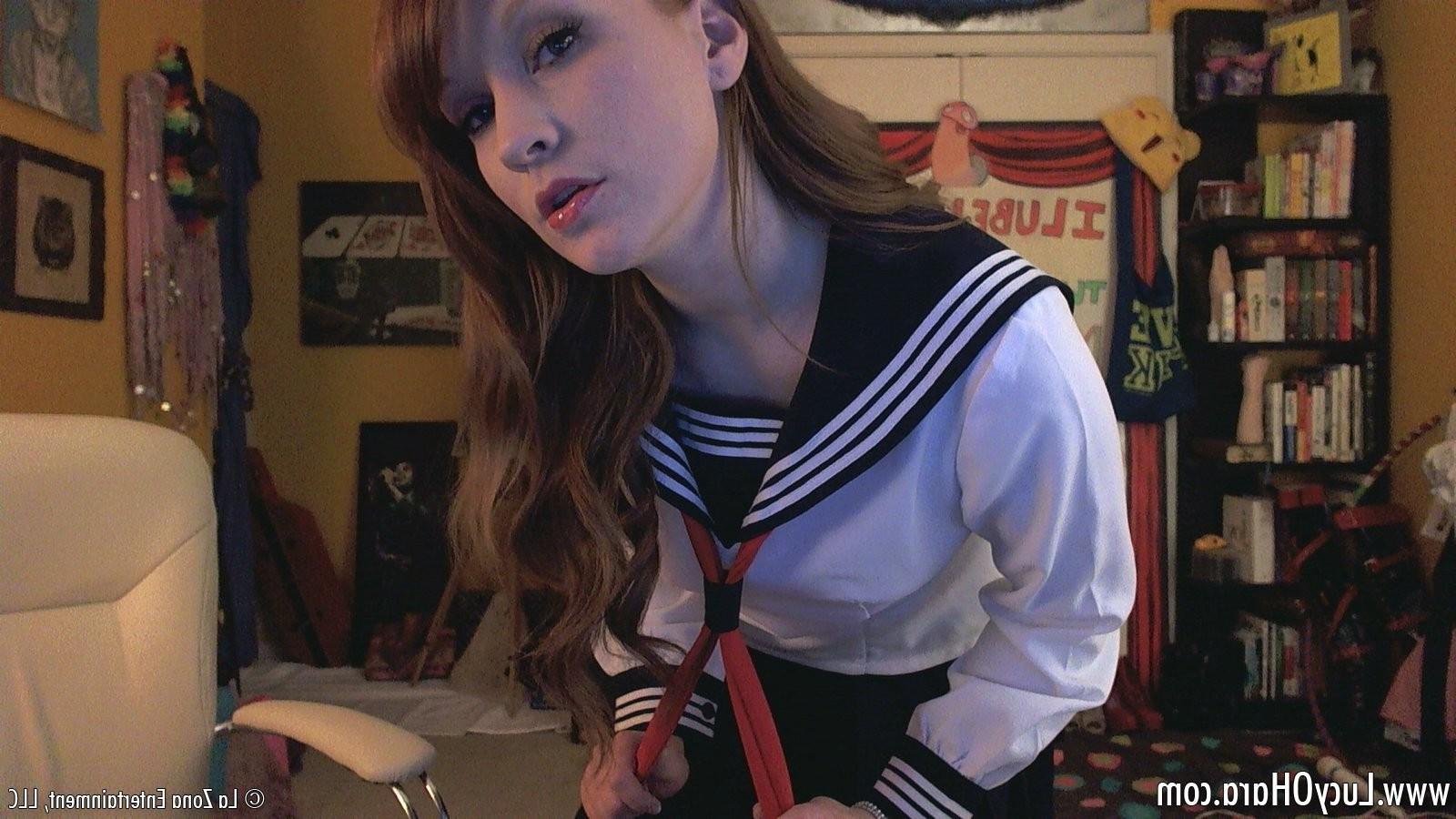 15P Busty redhead Lucy teases