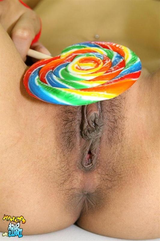 15P Skinny Thai girl Nina rubs a lolli on her pussy