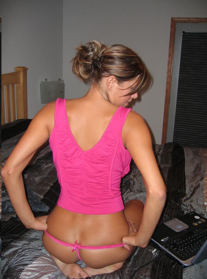 15P Melissa Midwest on her bed with a pink top and panties on