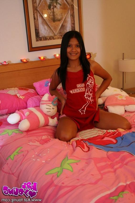 12P Kat poses on her bed