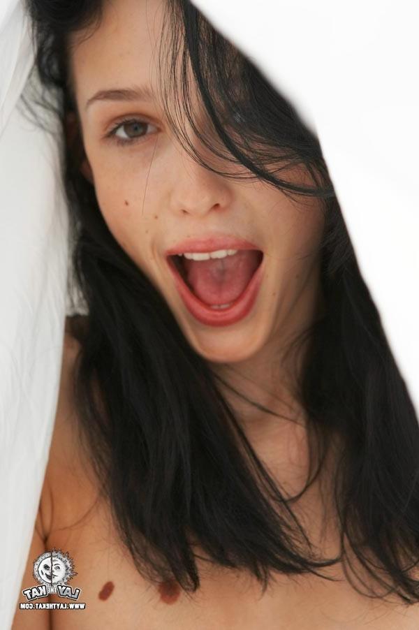 15P Delicious brunette posing with a condom
