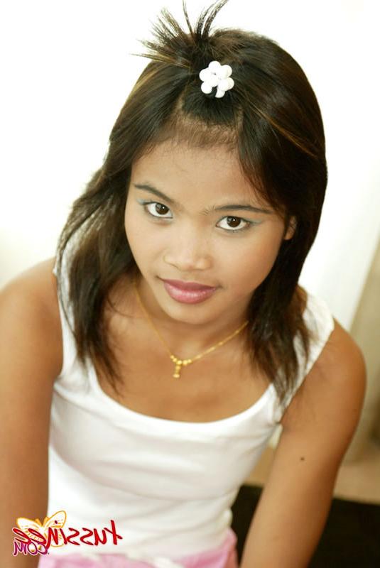 15P Thai Teen Tussinee plays with a teddy bear in bed
