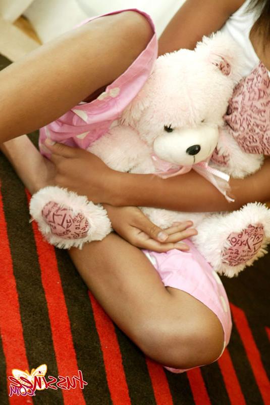 15P Thai Teen Tussinee plays with a teddy bear in bed