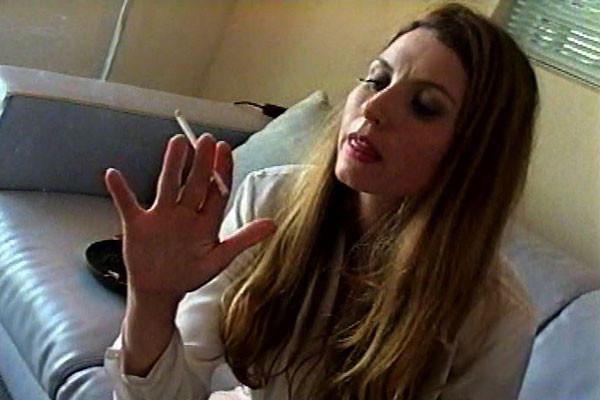 15P A young woman with long hair bares her breasts, utilizes a vibrator, and pensive