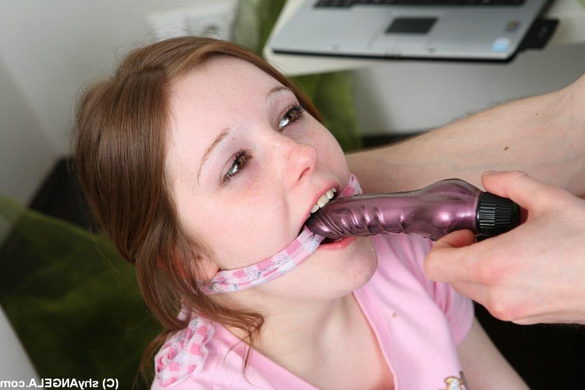 16P Nice redhead teen with tied hands gets pussy fucked by a guy with dildo