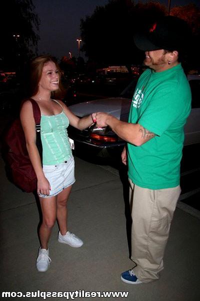 16P Sexy young redhead gets on her knees to suck off a hard reality dick