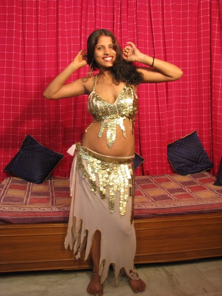 16P Young desi girl strips nude and fingers her shaved indian pussy