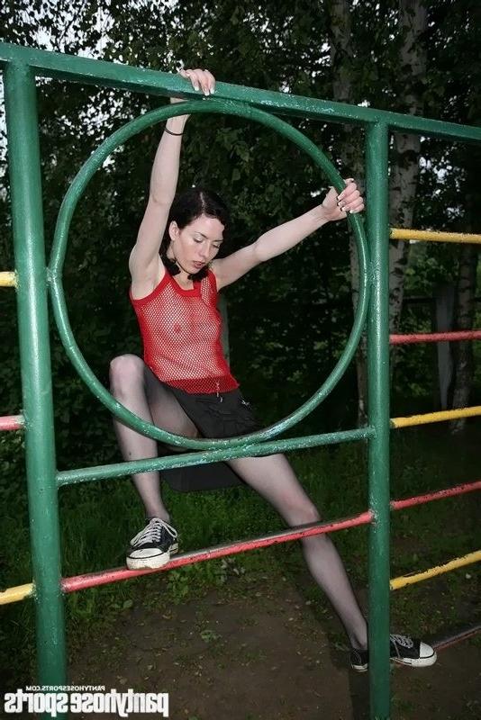 15P Sports missy in black tights exercises outdoors