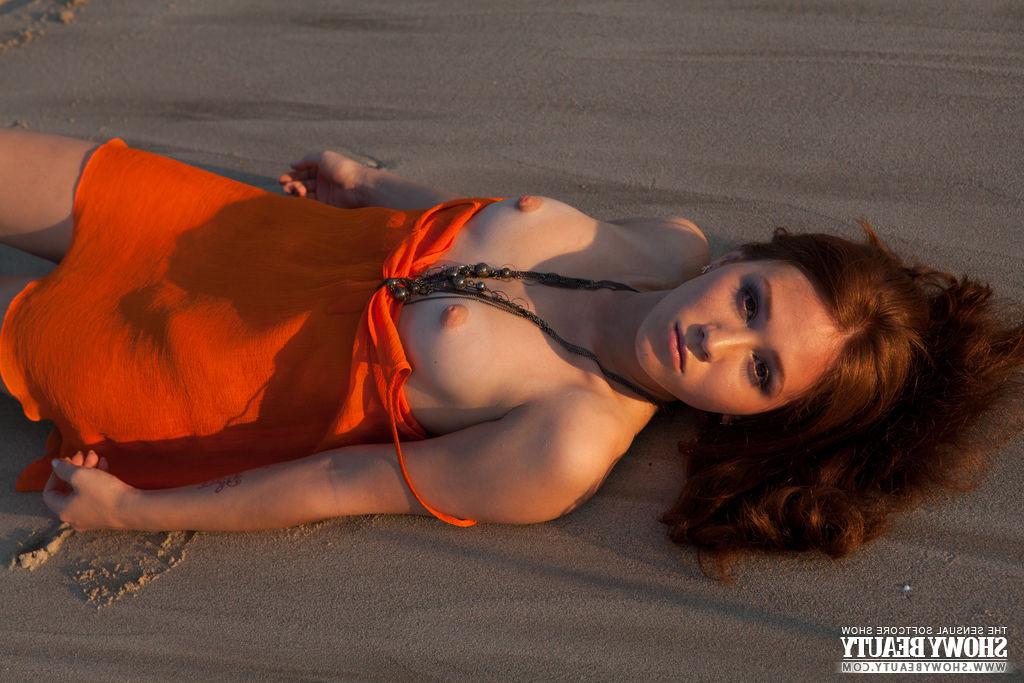 15P Redheaded Teen Showing off Her Pussy On the Beach