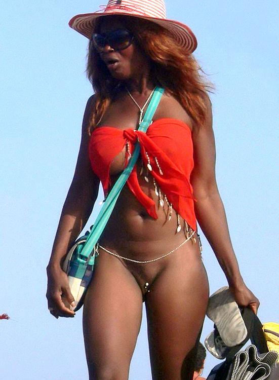 15P Two skinny nudist teens frolic around the beach