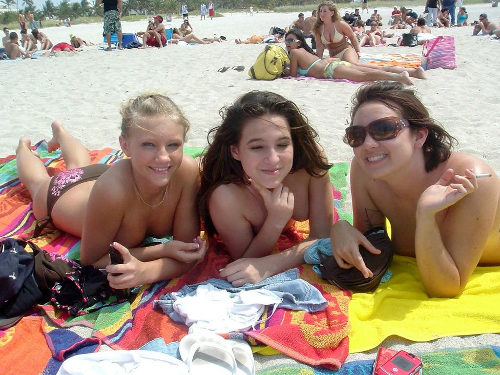 15P Beautiful fresh faced teen plays at the beach nude