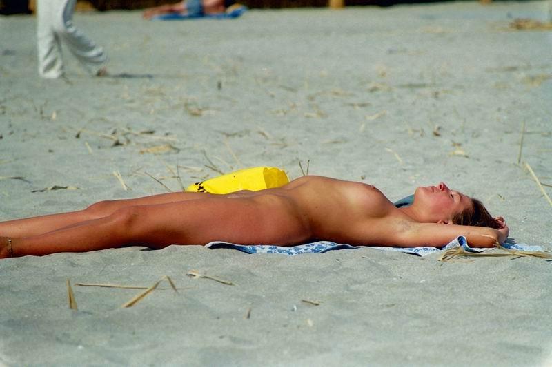 15P At the nudist beach teen girls play around naked