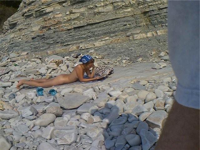 15P Sexy curvaceous cutie strips at a nudist beach
