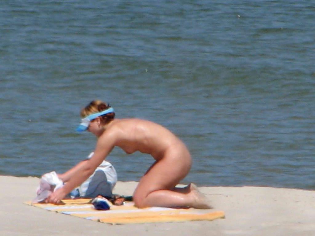 15P A pair of nudist teen friends steam up the beach