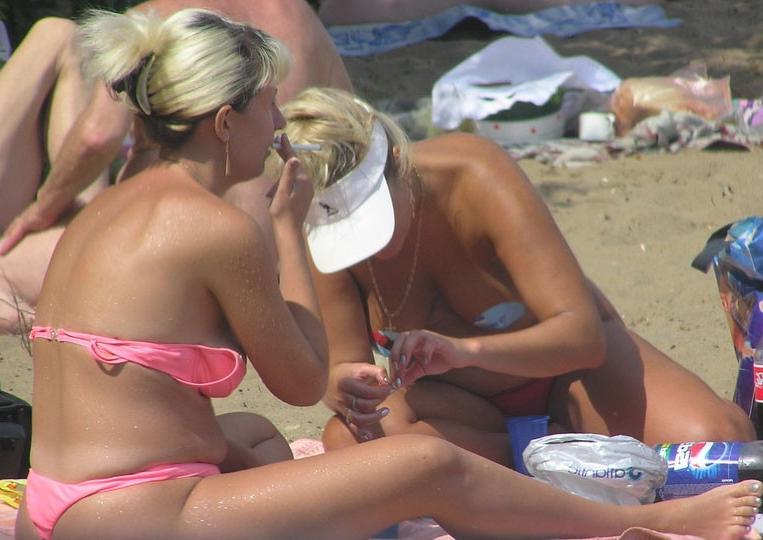 15P Brunette amazes the nude beach with her sexy body