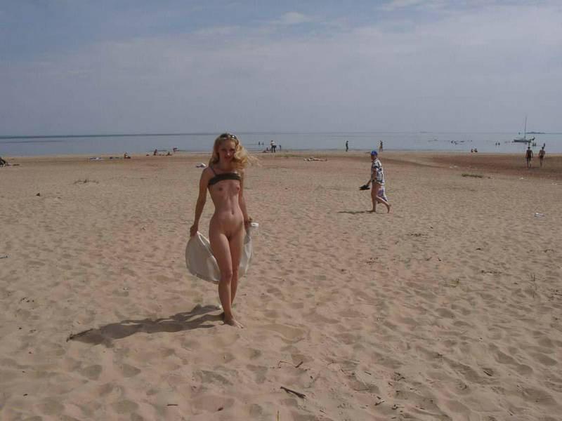 15P Brunette amazes the nude beach with her sexy body
