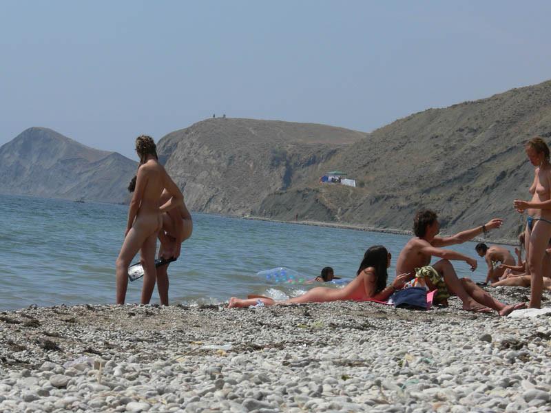 15P A public beach heats up with two hot teen nudists