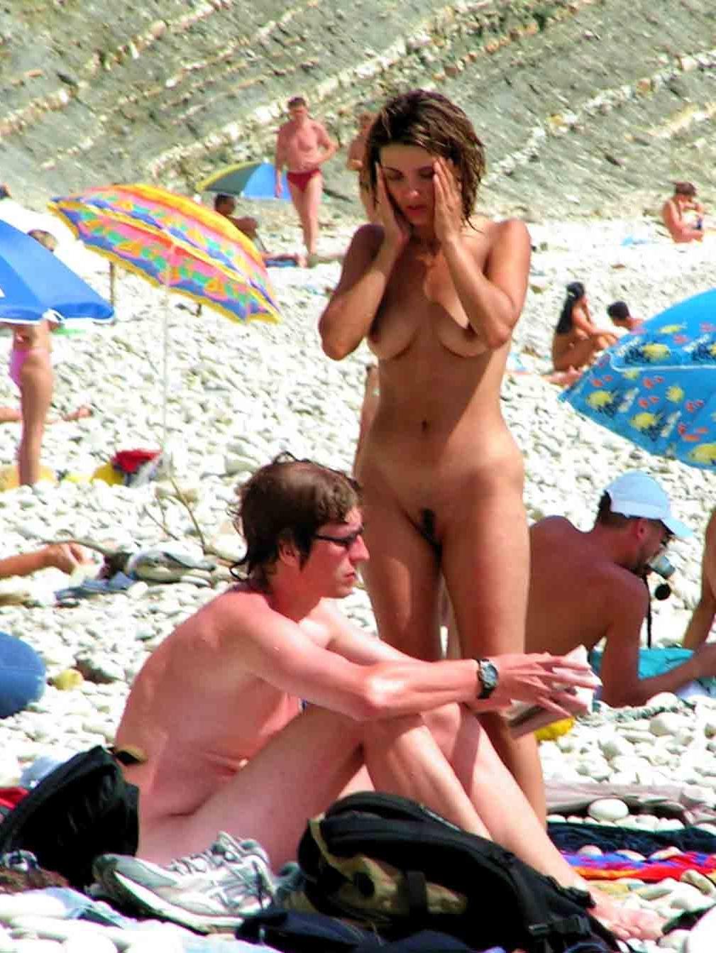 15P A public beach heats up with two hot teen nudists