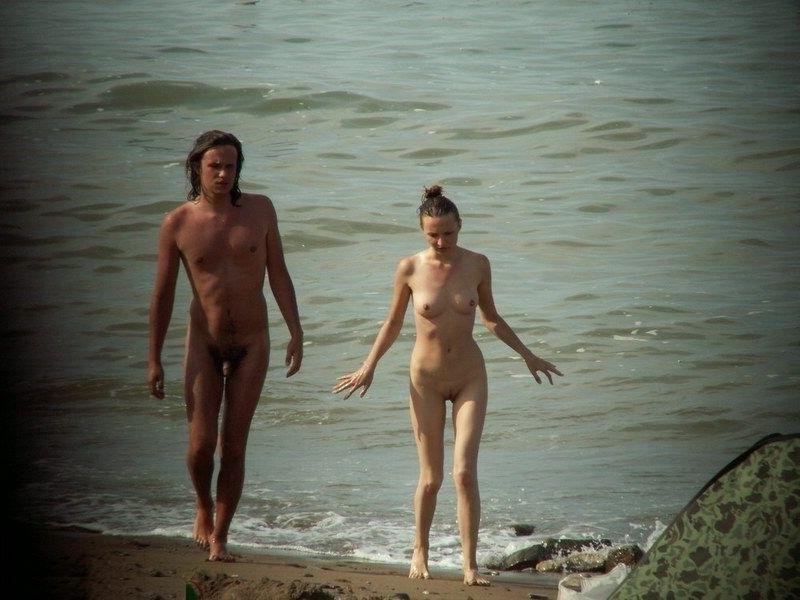15P Barely legal young nudist lays naked at the beach