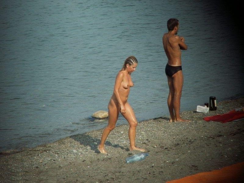 15P Barely legal young nudist lays naked at the beach