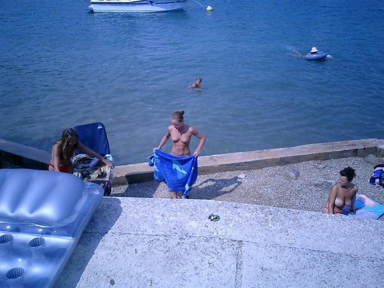 15P Barely legal nudist babe lights up at the beach