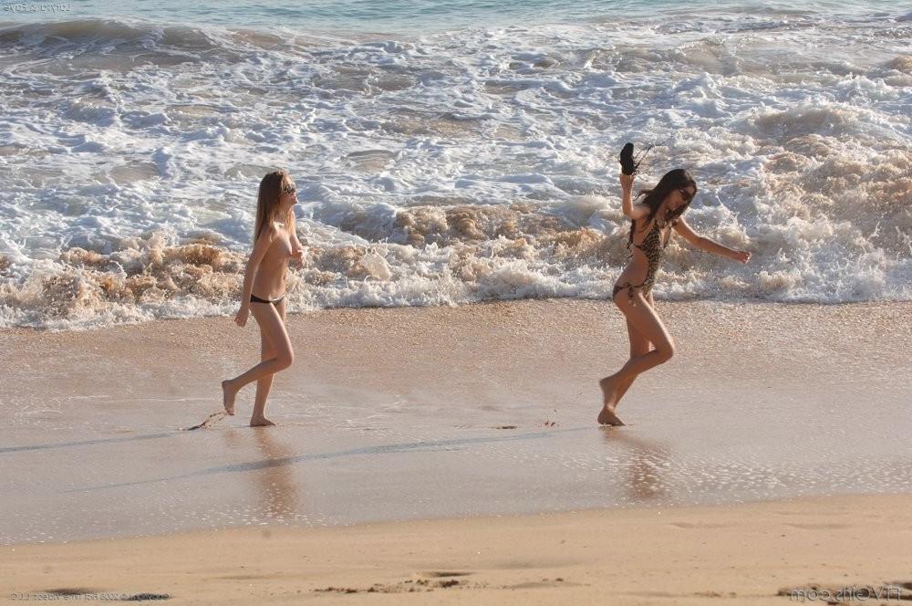 15P Two young bikini girl on beach shows off their big tities
