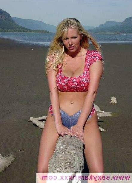 16P Karen Fisher Stripping At The Beach