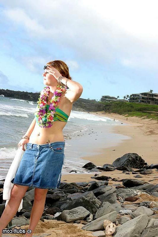 16P Hot sexy girl poses in and out of her bikini on the public beach