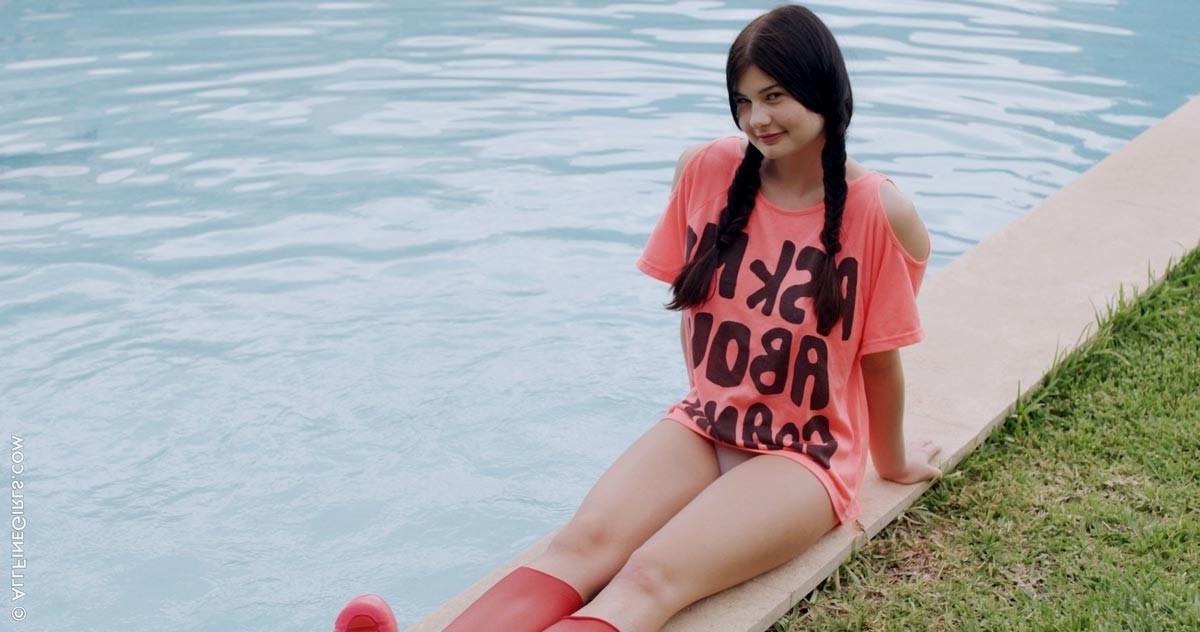 12P Busty pigtail brunette in a pool