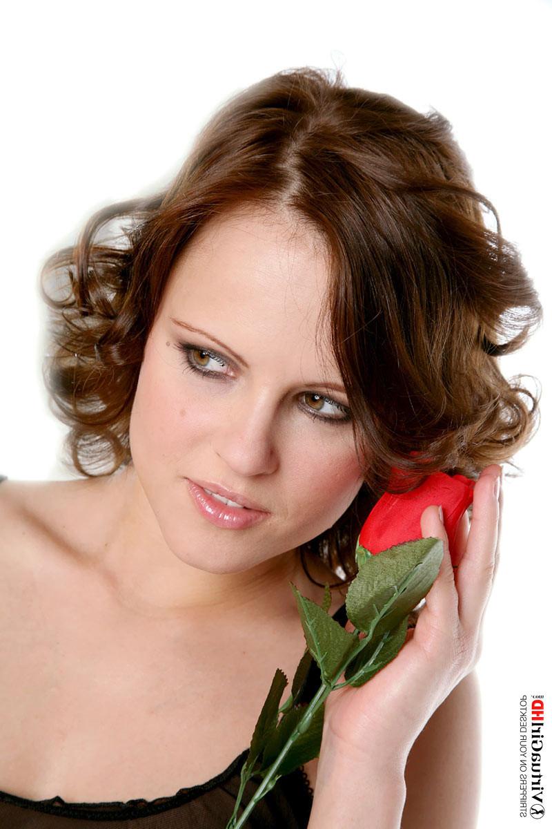 16P Delicious brunette Monica Sweet posing with a rose