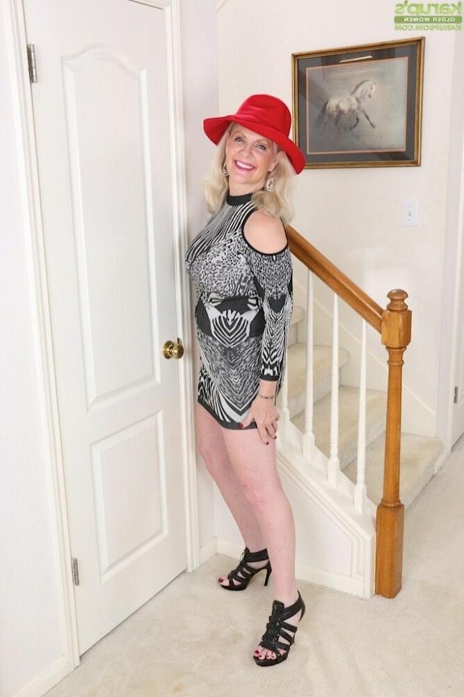 15P Judy Mayflower busty mature blonde poses in red hat