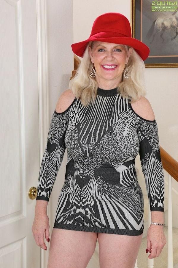 15P Judy Mayflower busty mature blonde poses in red hat