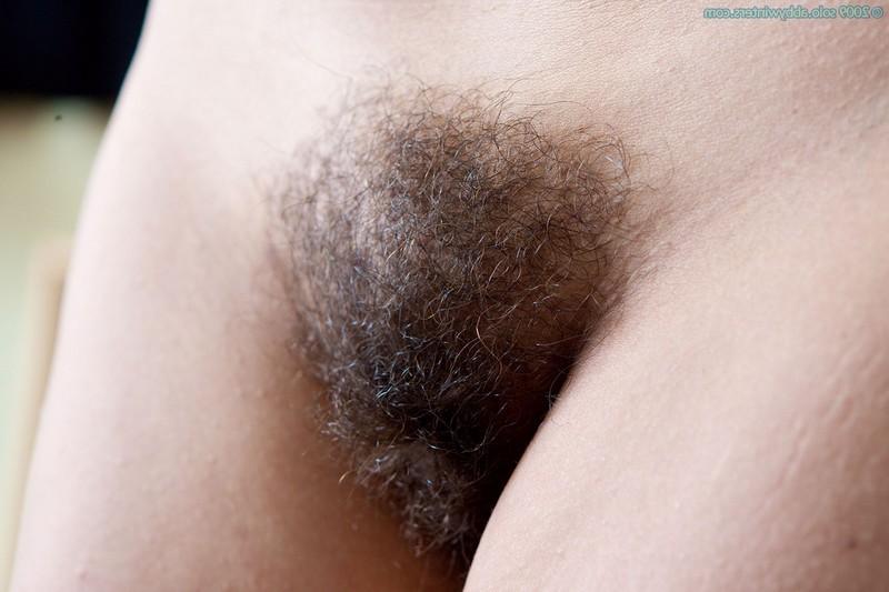 16P Busty amateur Edita strips and shows her hairy pussy