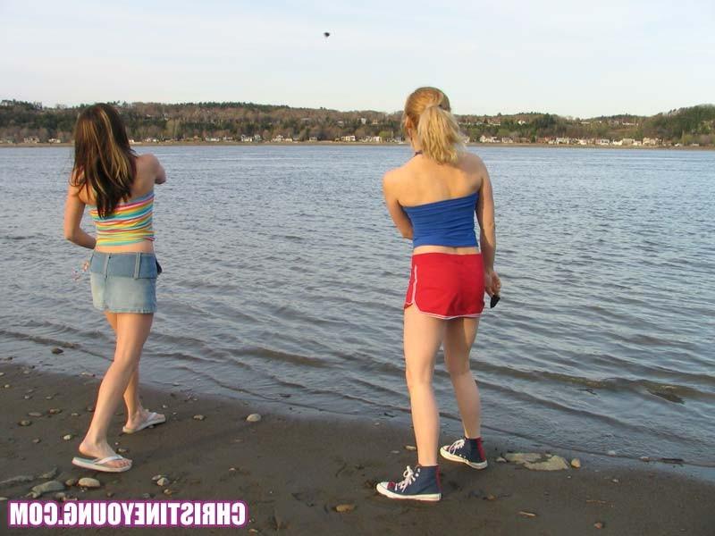 15P Two young lesbians teasing and having good fun by the water