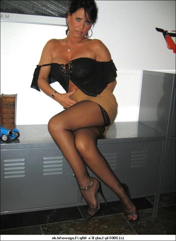 12P Busty german lady in black stockings