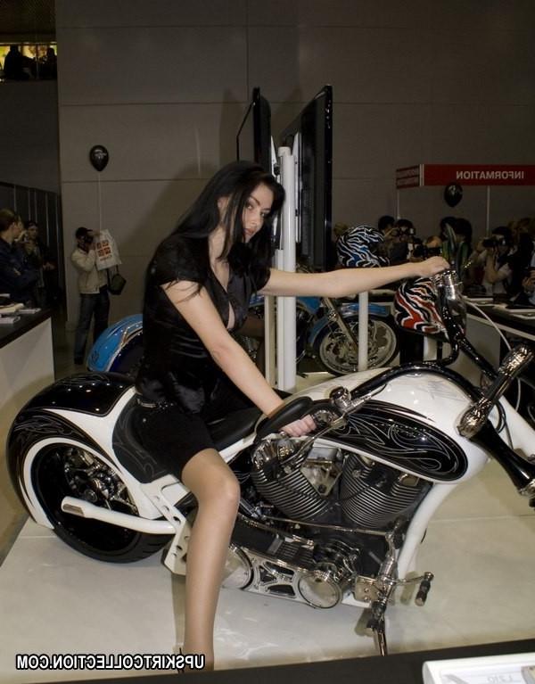 15P Brunette on the bike has her boobs seen under top