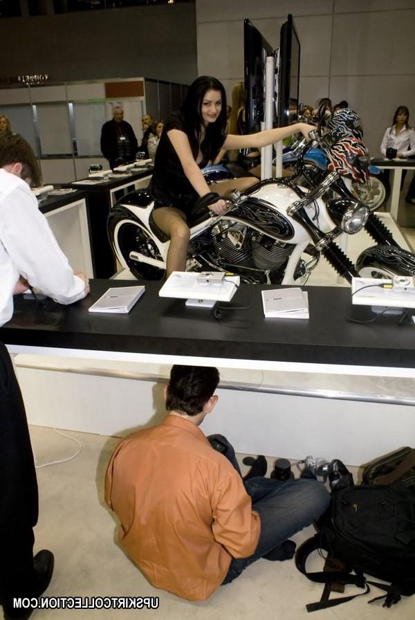 15P Brunette on the bike has her boobs seen under top