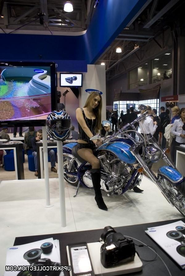 15P Brunette on the bike has her boobs seen under top