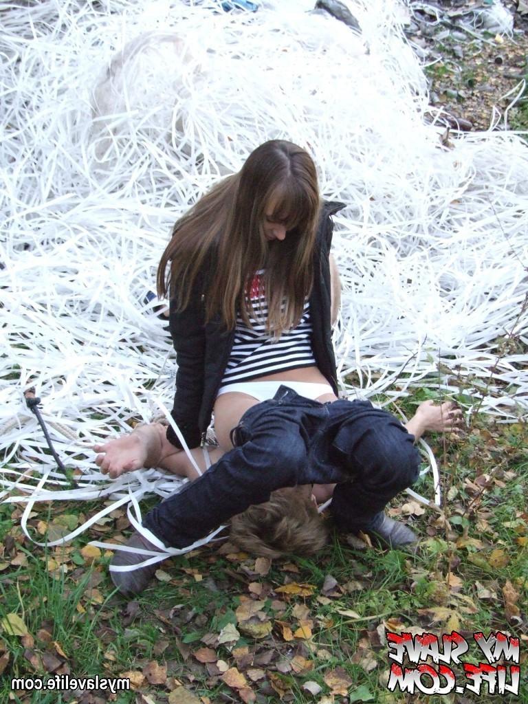 9P Lady bounds guy near the tree and uses him as ashtray