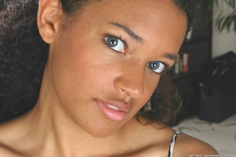 15P Beautiful exotic blue eyed ebony teen plays with her huge tits