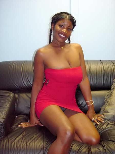 13P Busty black babe rubbing cream on her boobs