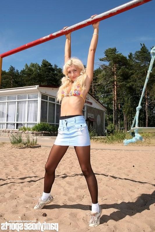 15P Blonde Anastasia in pantyhose doing exercises outdoors