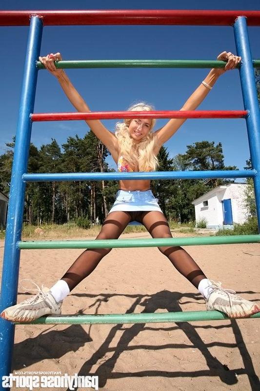 15P Blonde Anastasia in pantyhose doing exercises outdoors