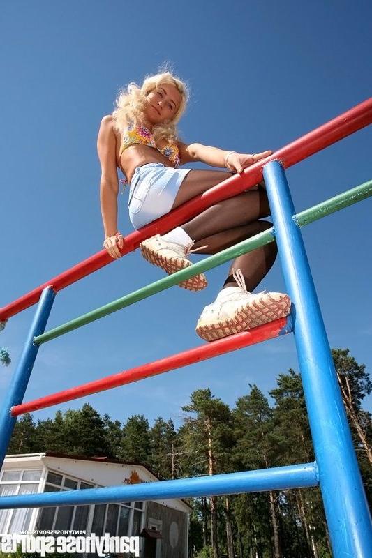 15P Blonde Anastasia in pantyhose doing exercises outdoors