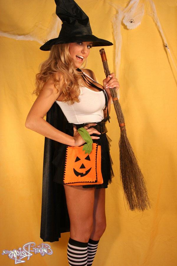 15P Ember Reigns busty babe dressed as a sexy halloween witch